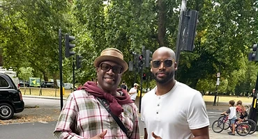 Brothers standing together in a London park