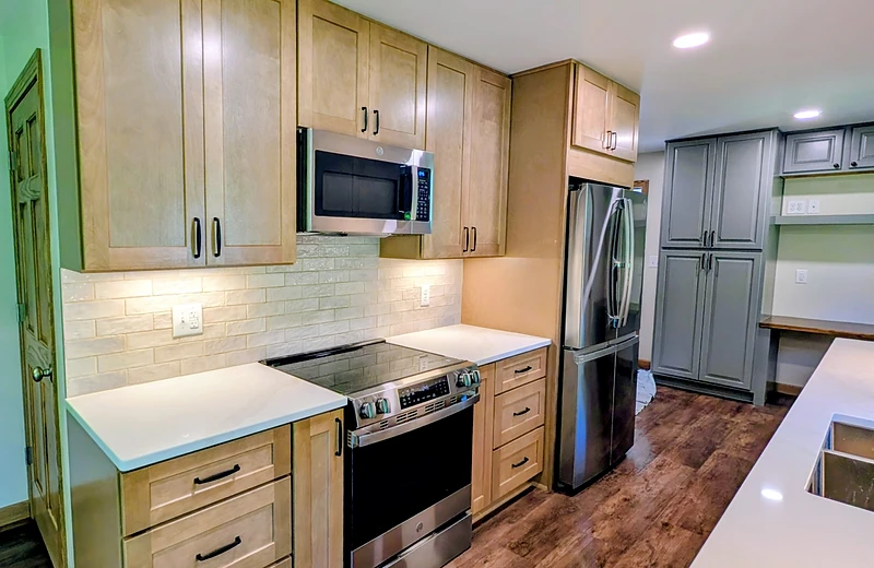 Bright renovated kitchen with white and oak cabinetry