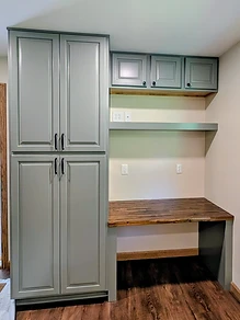 Home office built-in with custom cabinetry and butcher-block desk