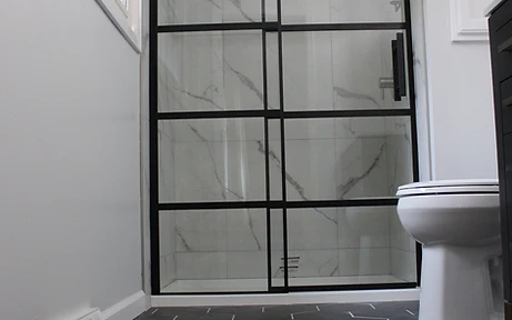 Renovated bathroom with walk-in shower and custom vanity
