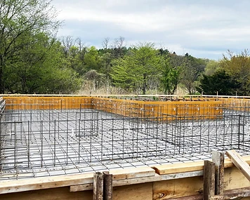 Residential foundation with steel reinforcement and timber formwork prepared for concrete