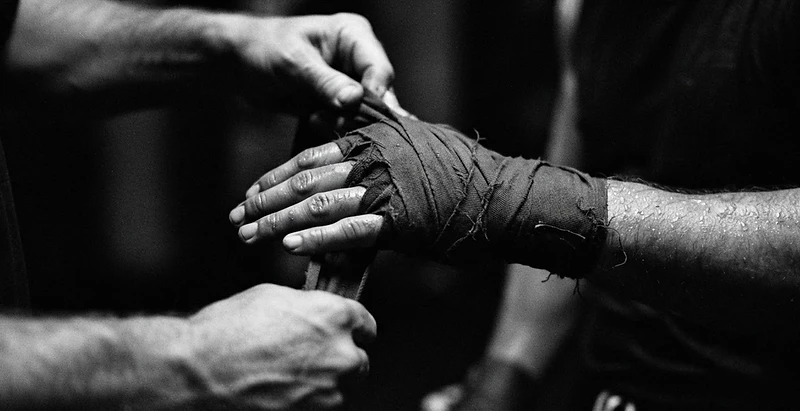 Fighter wrapping hands at Tru Bloodline MMA & Fitness in Kemah, TX