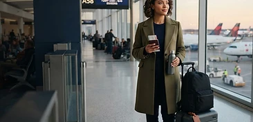 Traveller preparing for an international trip at a modern airport