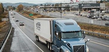 Commercial truck traveling toward an international border crossing
