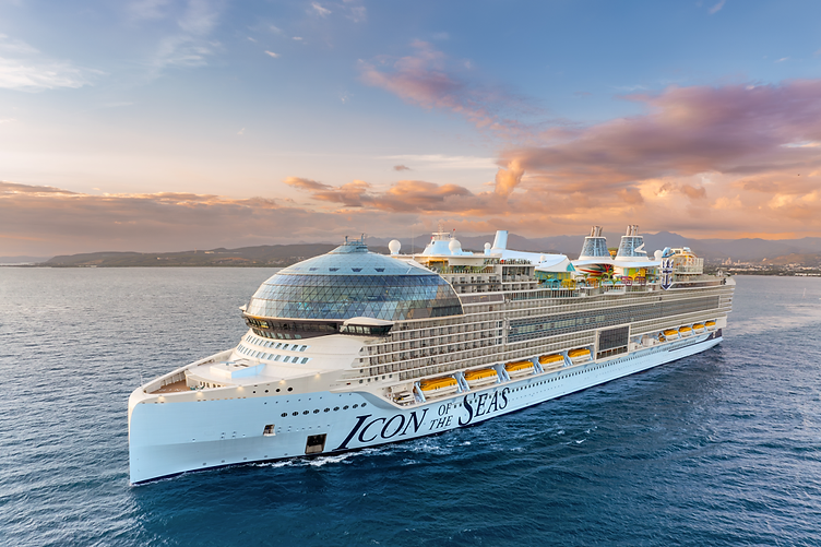 The Royal Caribbean Icon of the Seas ship sailing on the open ocean at sunset