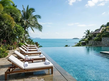 Resort infinity pool overlooking a tropical ocean