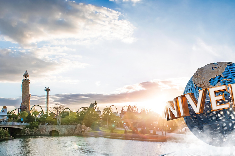 Universal Studios spinning globe monument at sunset