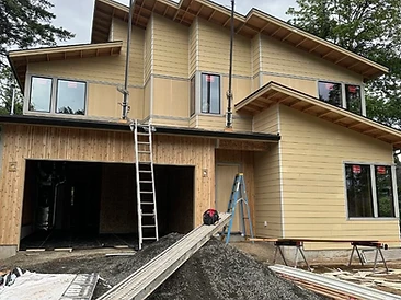 Lap siding & panel siding installed — fully finished exterior