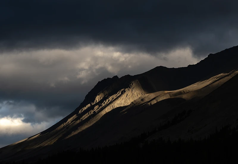 Light breaking over a mountain valley