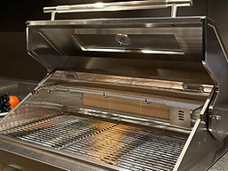 BBQ system on a pine forest deck at twilight