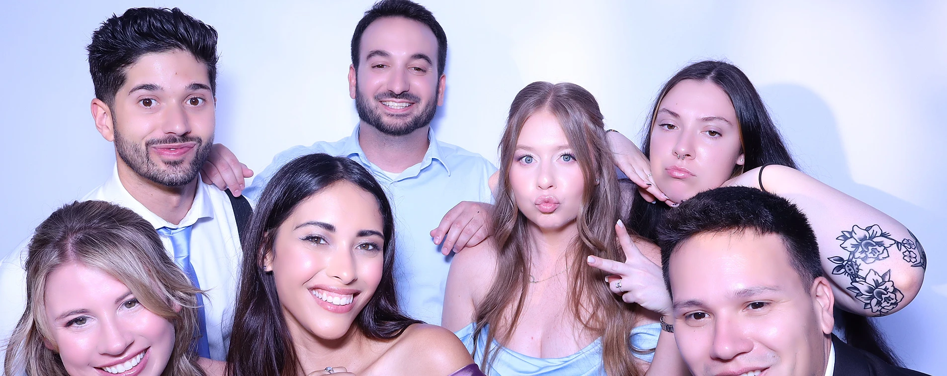 Guests taking photos at the PhotoBoo Selfie Booth