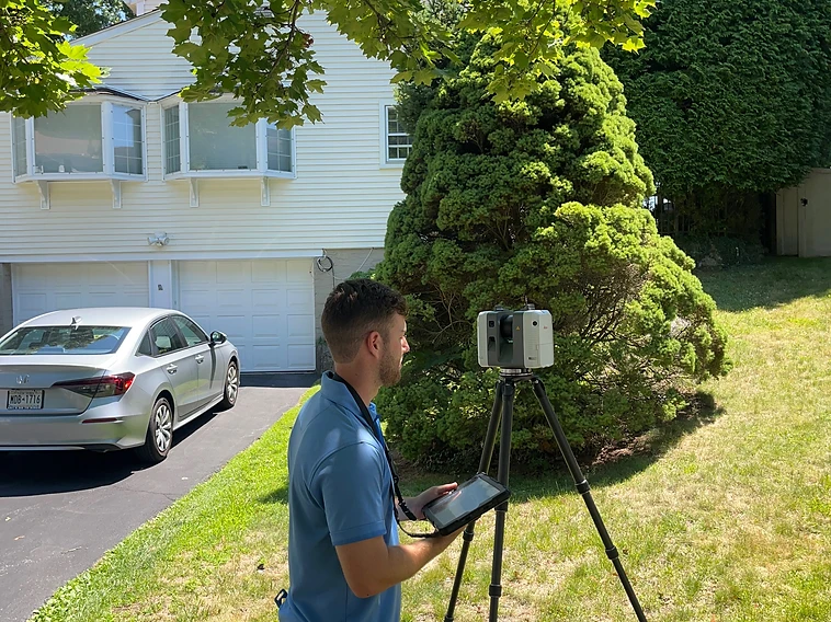 Scanning technician operating a Leica scanner on-site