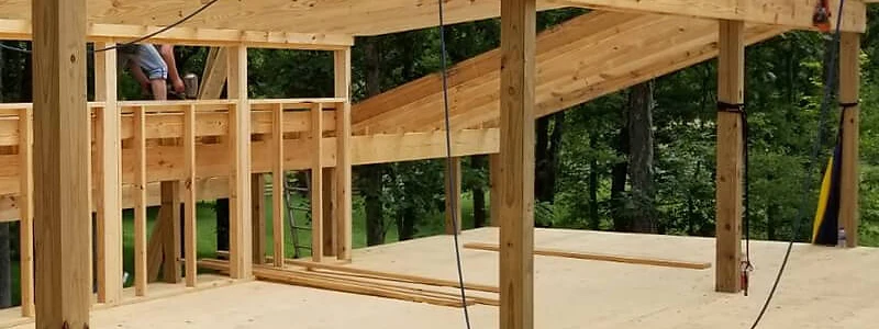 Timber frame barn construction by Backyard and Barns