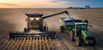 Combine unloading dry beans into a grain cart during the southern Manitoba harvest