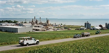 Service trucks and lake-shore farm country in Haldimand County, Ontario