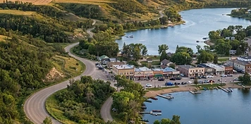 Valley lakes, resort storefronts and trade service trucks in the Qu'Appelle Valley at Fort Qu'Appelle, Saskatchewan