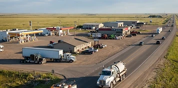 Trans-Canada Highway commercial frontage with fuel, motel and equipment businesses at Moosomin, Saskatchewan