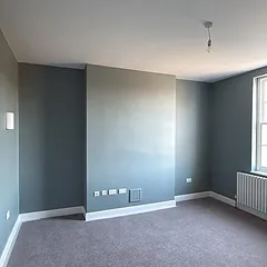Sage green bedroom redecorated in West London