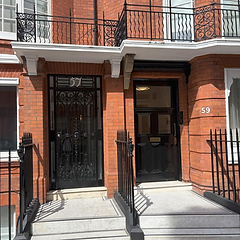 Victorian townhouse front doors finished in gloss black