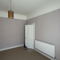 Taupe bedroom with new carpet and brass pendant light