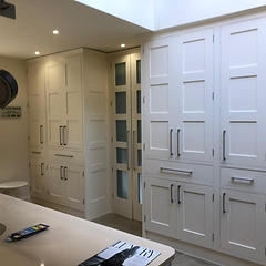 Cream shaker kitchen with fitted cabinetry, pantry and island