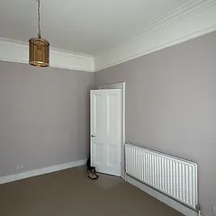 Hallway in soft mauve with white woodwork, West London