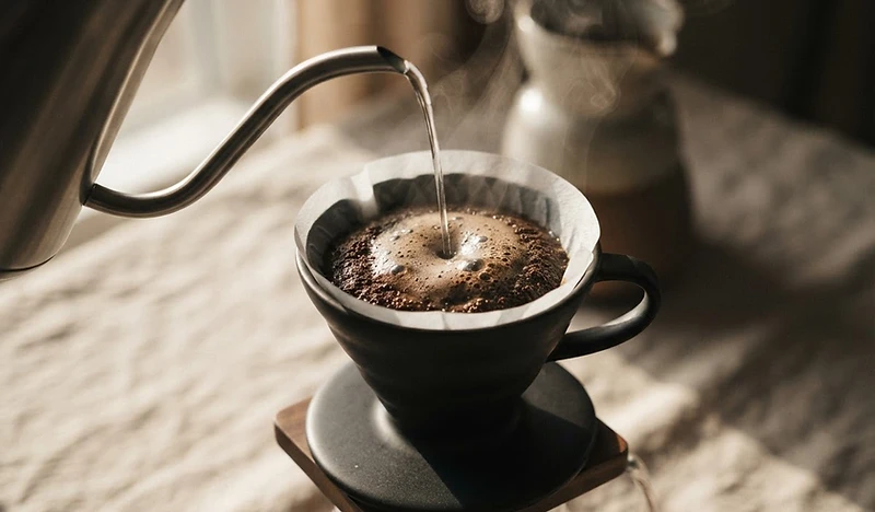 Slow water pour into a ceramic dripper