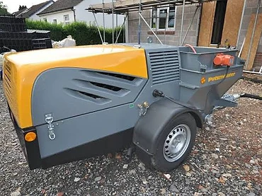 Putzmeister trailer-mounted screed pump — MPC Plastering