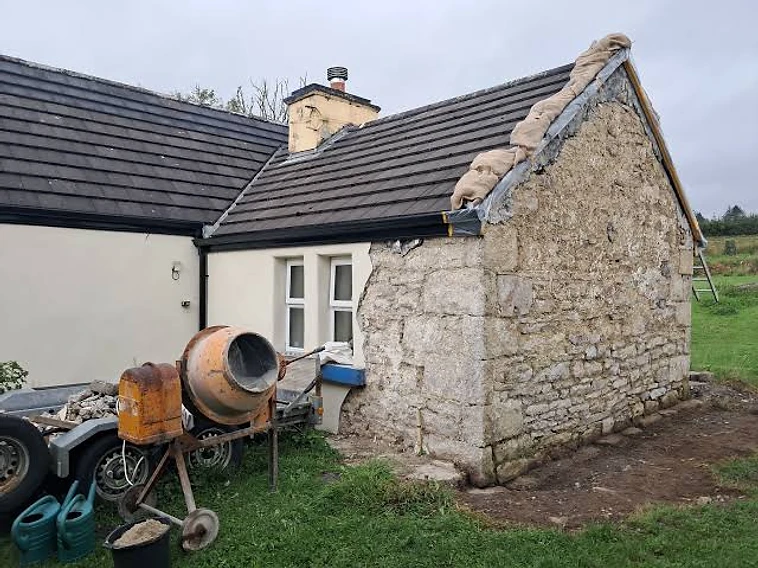 Traditional stone gable alongside a finished lime-rendered wall — MPC Plastering