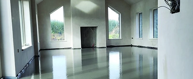 Completed liquid screed floor with a smooth, level, reflective finish — MPC Plastering