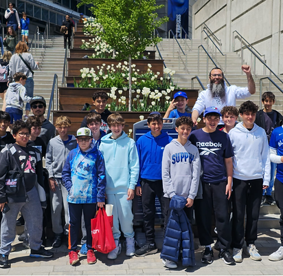 The BMC crew with Rabbi Benny on the steps outside the stadium before a Blue Jays game