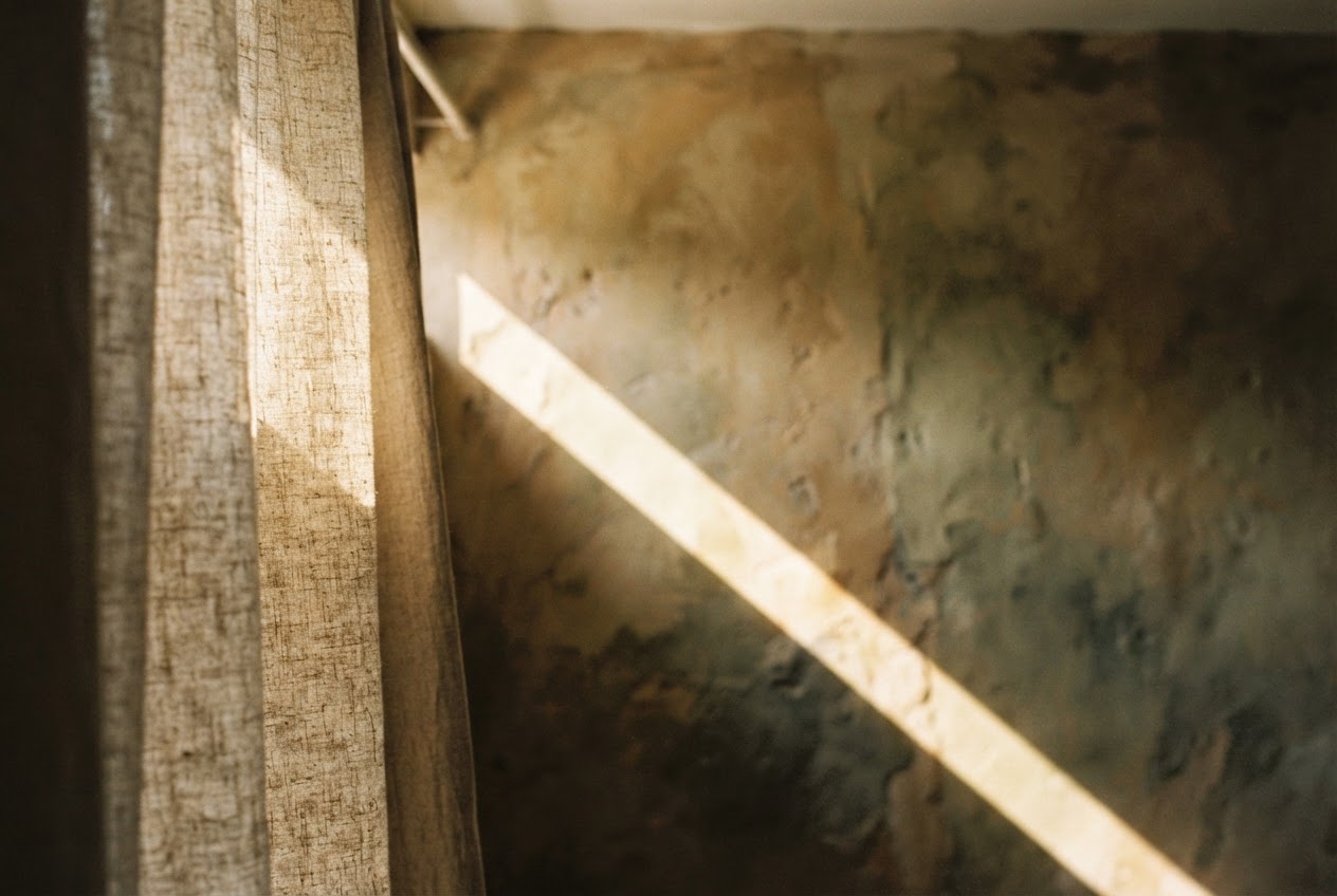 Morning light through a linen curtain