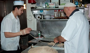Noodles being made by hand in the kitchen