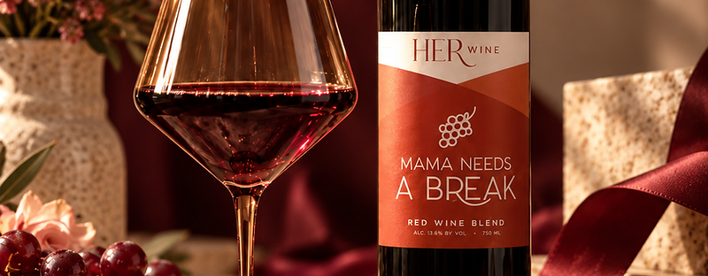A HER Wine package with a bottle and keepsake glass