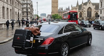 An executive saloon arriving in Central London after collecting passengers from Southampton cruise terminal