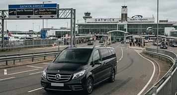 An executive vehicle collecting passengers at Gatwick Airport for a cruise transfer
