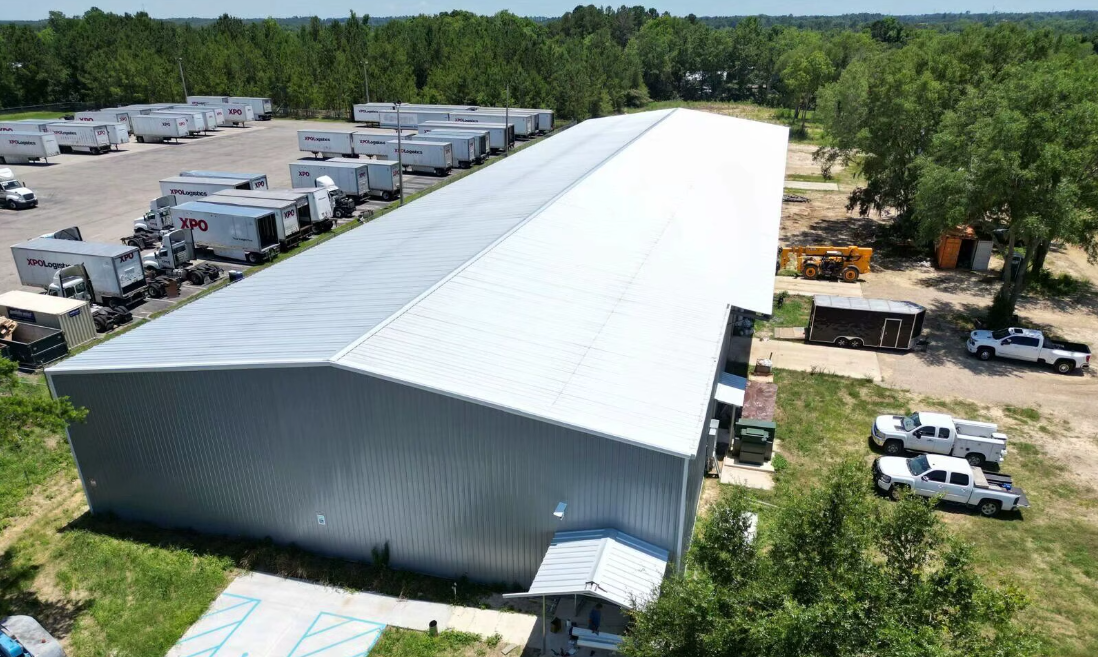 Completed industrial facility with standing seam roof