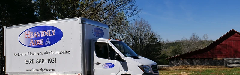 Heavenly Aire residential heating and air conditioning service truck parked in a rural Upstate South Carolina setting near Seneca.