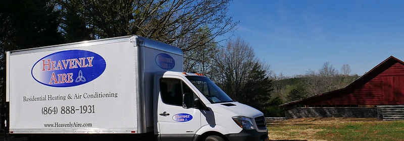 Heavenly Aire residential heating and air conditioning service truck parked in a rural Upstate South Carolina setting near Seneca.