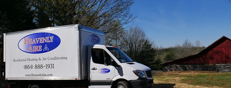 Heavenly Aire residential heating and air conditioning service truck parked in a rural Upstate South Carolina setting near Seneca.