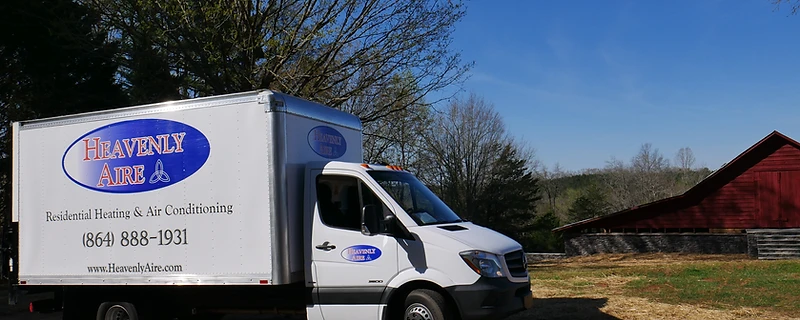 Heavenly Aire residential heating and air conditioning service truck parked in a rural Upstate South Carolina setting near Seneca.