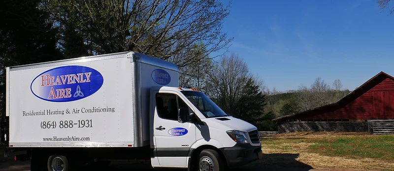 Heavenly Aire residential heating and air conditioning service truck parked in a rural Upstate South Carolina setting near Seneca.