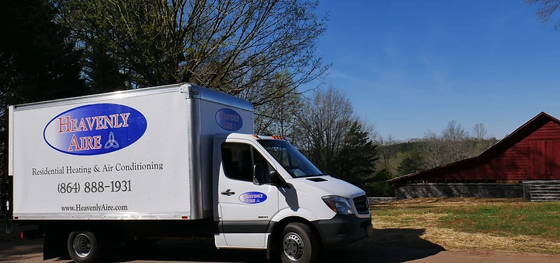 Heavenly Aire residential heating and air conditioning service truck parked in a rural Upstate South Carolina setting near Seneca.