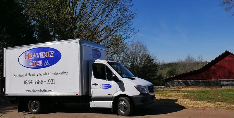 Heavenly Aire residential heating and air conditioning service truck parked in a rural Upstate South Carolina setting near Seneca.