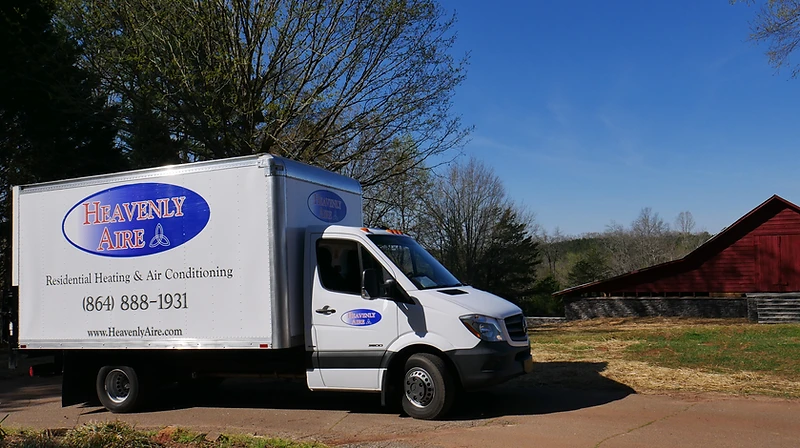 Heavenly Aire residential heating and air conditioning service truck parked in a rural Upstate South Carolina setting near Seneca.