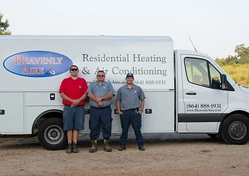 Three Heavenly Aire staff members standing in front of a company service van in Seneca, SC.