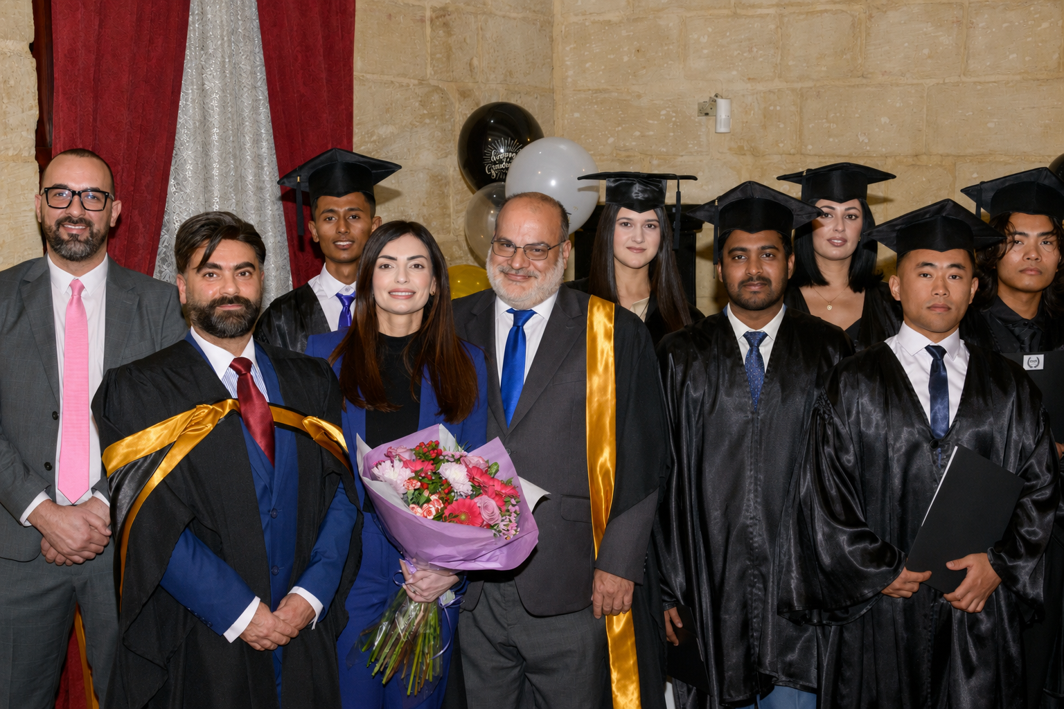 TTS graduates and faculty group portrait