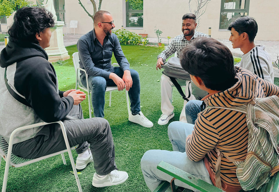 Students in a group discussion outdoors
