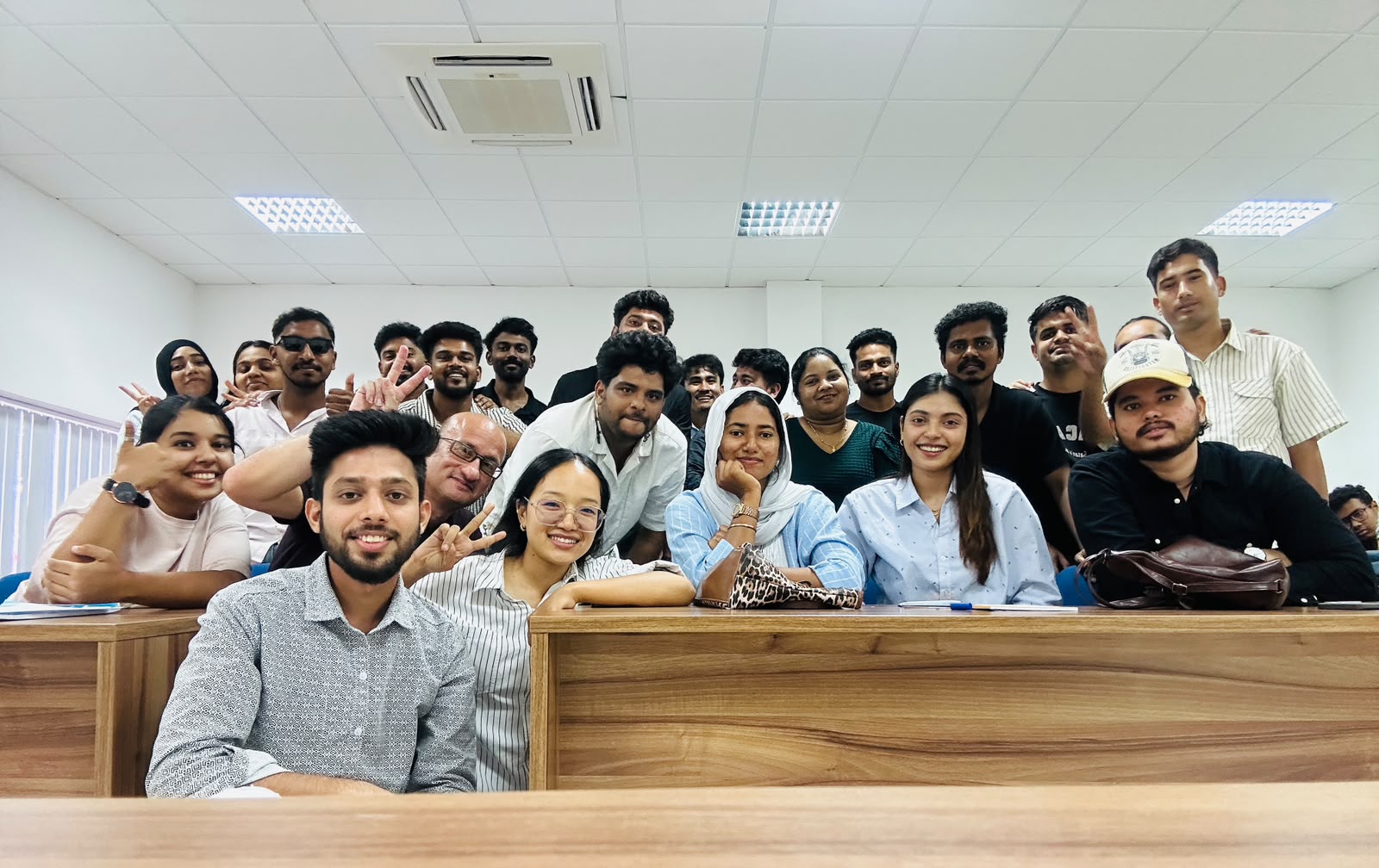 TTS students posing for a group photo during class
