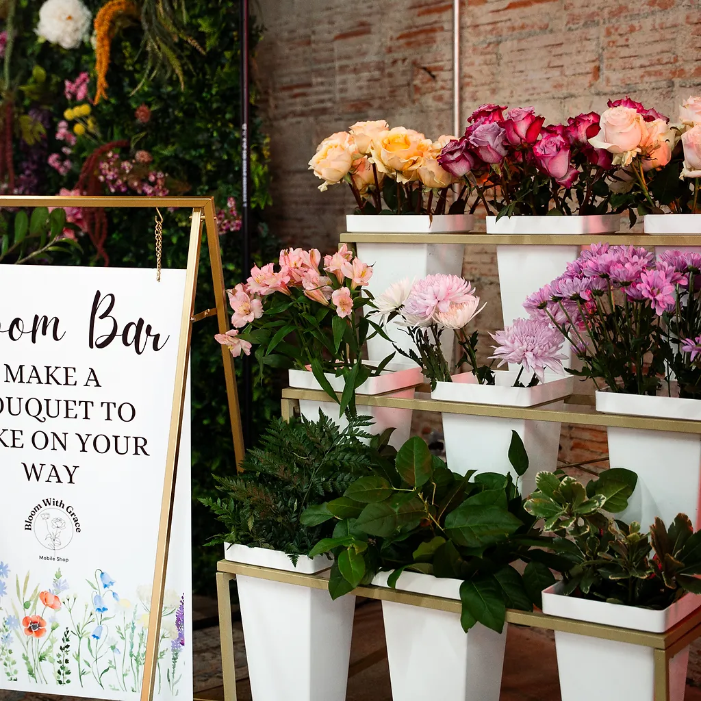 Tiered roses and spring blooms on display at the Bloom Bar flower booth
